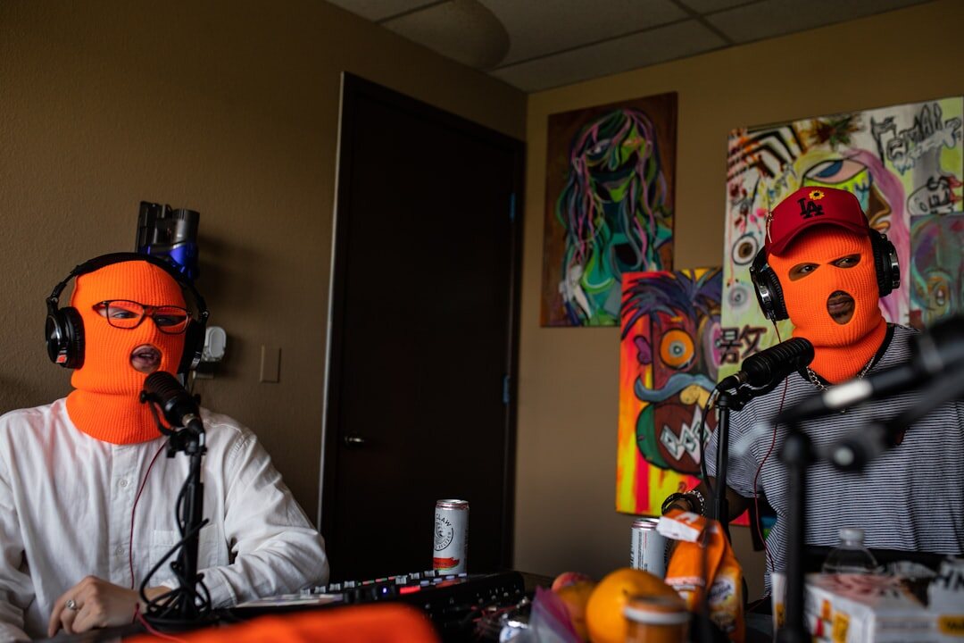 Professional podcast recording session with two hosts wearing headphones